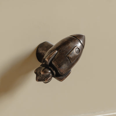 Photography by Joey Kendal Brown | Whimsical Rocket Cabinet Knob shown in our medium aged bronze finish.