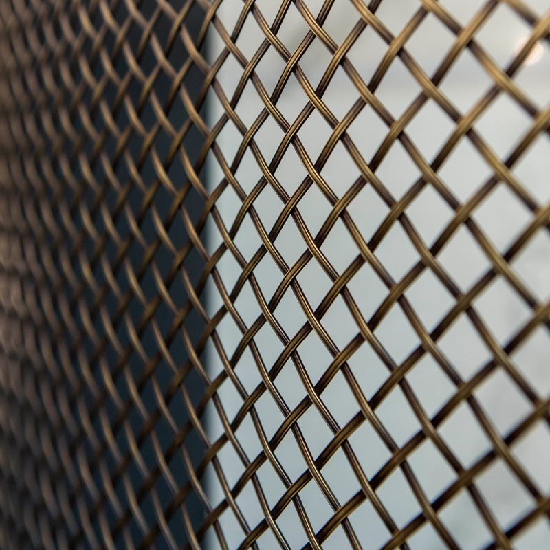 Features our 13mm Diamond Interwoven Grille with 3mm Reeded Wire in our antique brass lacquered (ABL) grille finish | Project by Barr Kitchens.