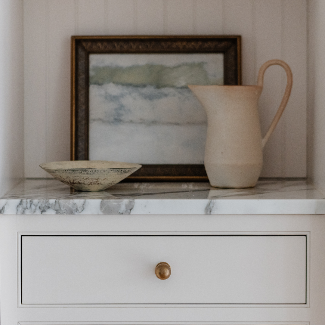Design by JK Interior Living. Product shown in our aged brass (BEL) finish. 