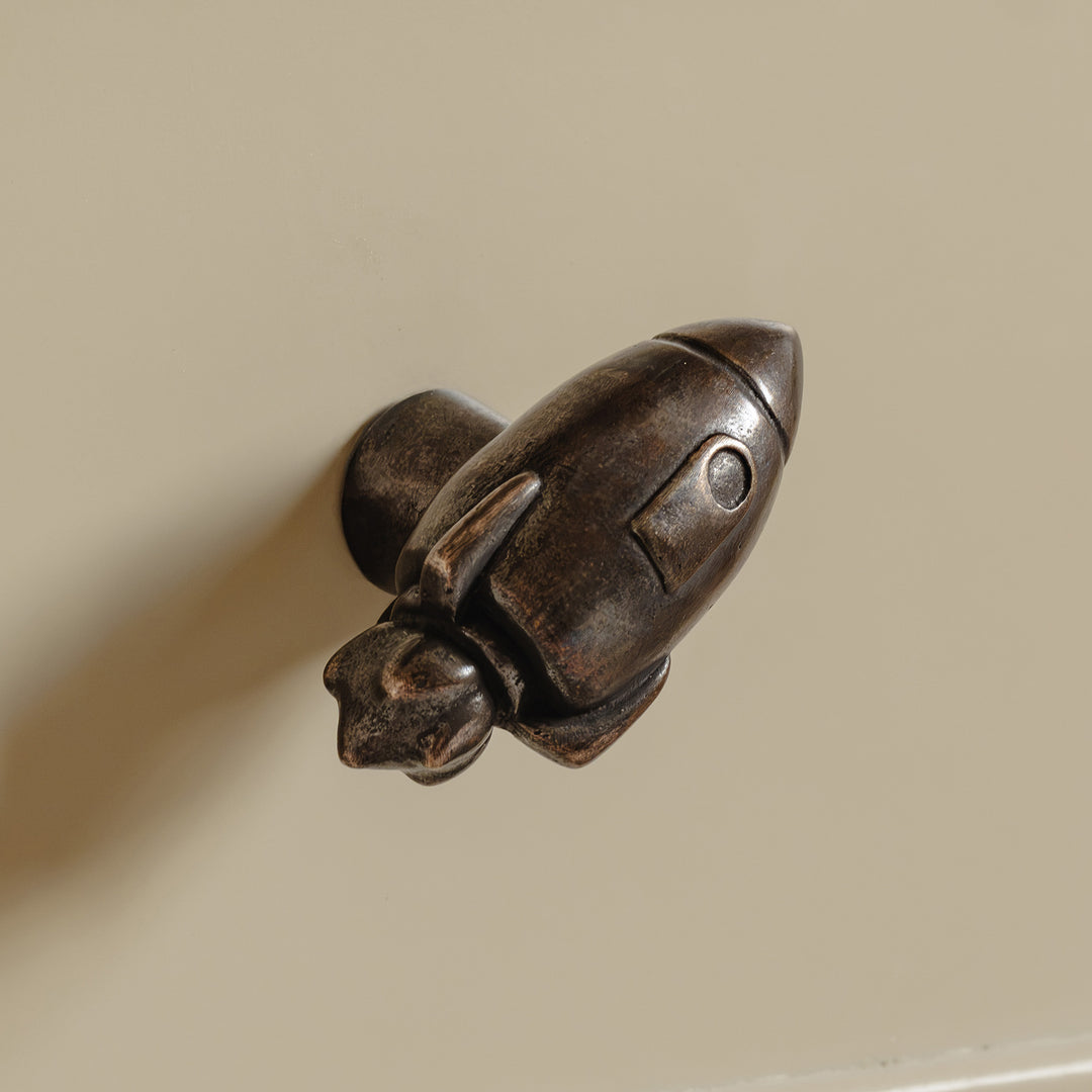 Photography by Joey Kendal Brown | Whimsical Rocket Cabinet Knob shown in our medium aged bronze finish.
