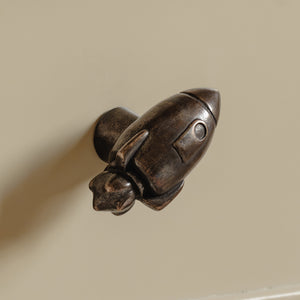 Photography by Joey Kendal Brown | Whimsical Rocket Cabinet Knob shown in our medium aged bronze finish.